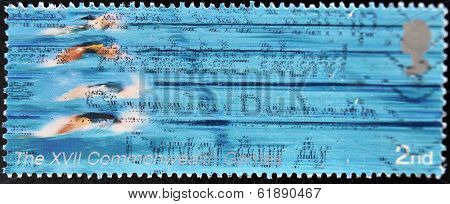 UNITED KINGDOM - CIRCA 2005: A Stamp printed in Great Britain showing swimmers XVI commonwealth game