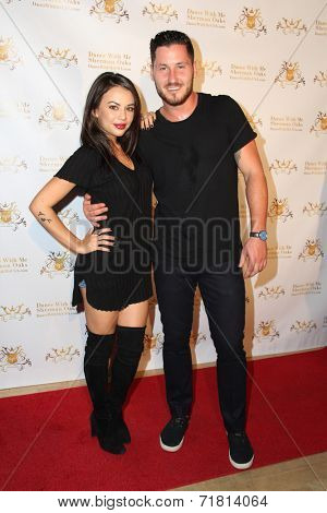 LOS ANGELES - SEP 10:  Janel Parrish, Valentin Chmerkovskiy at the Dance With Me USA Grand Opening at Dance With Me Studio on September 10, 2014 in Sherman Oaks, CA