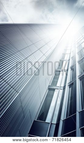 futuristic glass and steel skyscraper seen from below, Frankfurt am Main, Germany