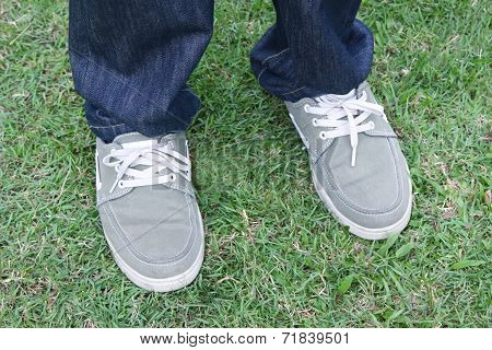 shoes in a row standing on the ground.