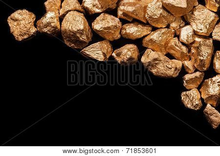 Gold Nuggets On Black Background.