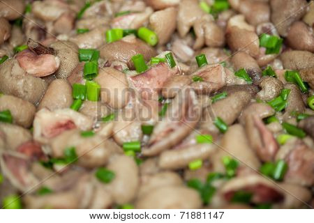 Fried luteus with green onion close-up
