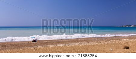 The sun beats down on a near-deserted beach in the west of Cyprus