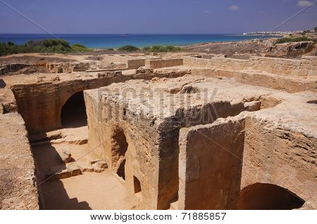 The ancient burial places cut deep into the rock in Paphos