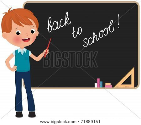 Schoolboy Standing At The Blackboard
