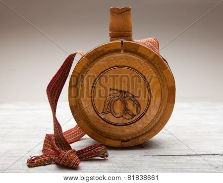 Old Wooden Bottle On Wooden Background