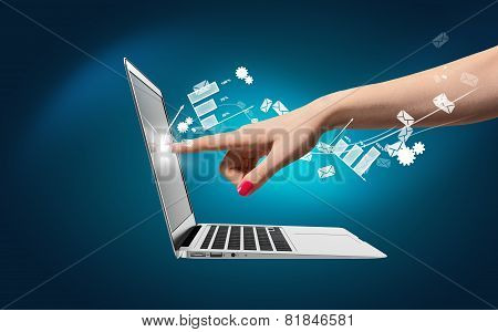 Hand touch laptop, icons around