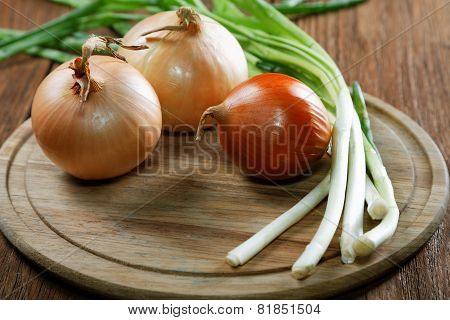 Onions Napiform And Green On An Old Rural Table