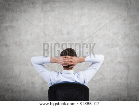 Businessman Looking On Wall