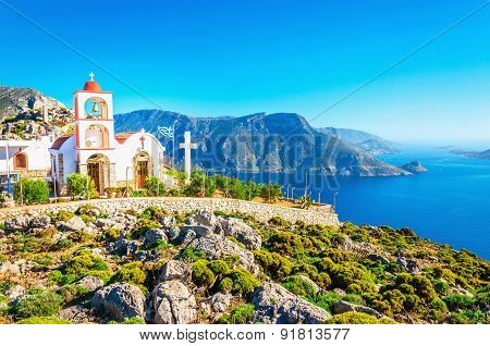 Sea bay on Greek Island with white church
