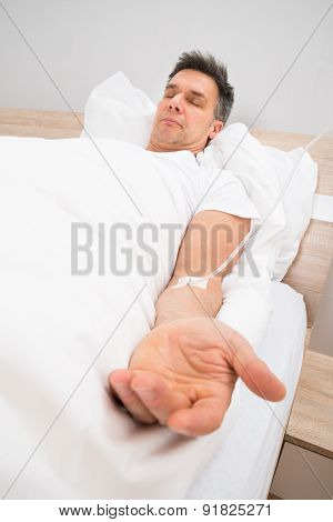 Patient Resting On Bed With Iv Drip