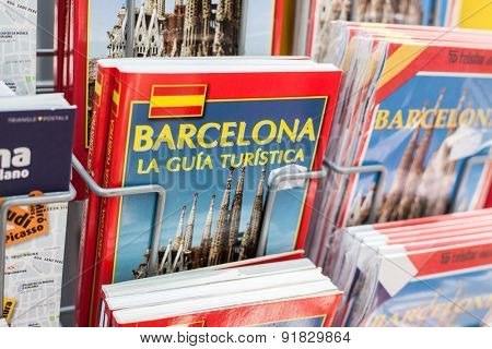 BARCELONA, SPAIN - APRIL, 2015: Barcelona guidebooks offered at market stall on La Rambla