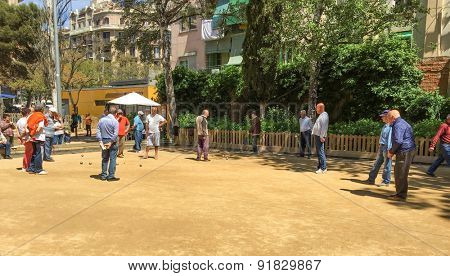 BARCELONA, SPAIN - APRIL, 2015: Seniors playing boule in park in Barcelona