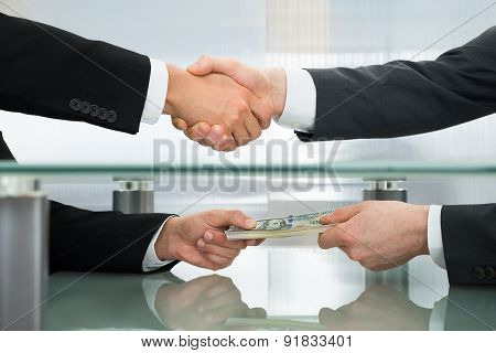 Businessman Accepting An Offer Of Money