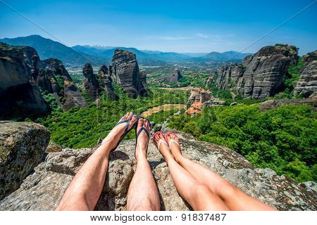 Couple sitting together on the mountain