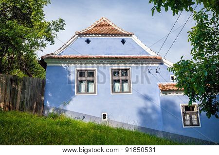 Blue Painted Traditional House From Viscri Village In Transylvania, Romania