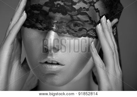 Woman With Gold Make Up And Lace On Face