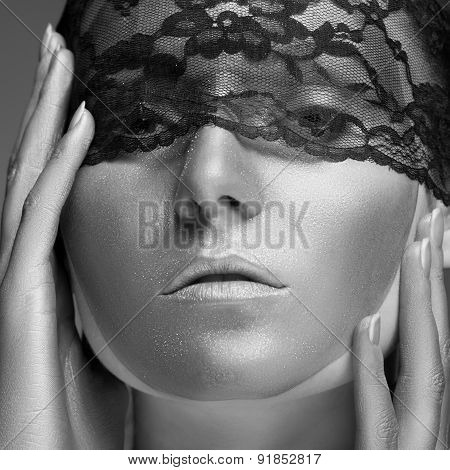 Woman With Gold Make Up And Lace On Face