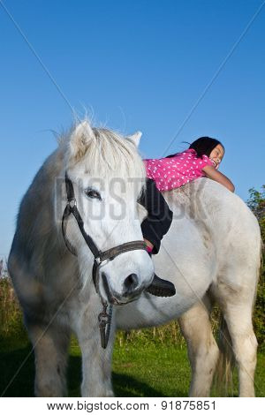 Girl Ridding A White Horse In Denmark
