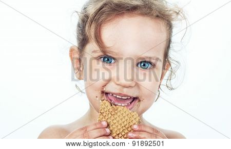 Beautiful Sweet  Little Girl Eating A Cookie