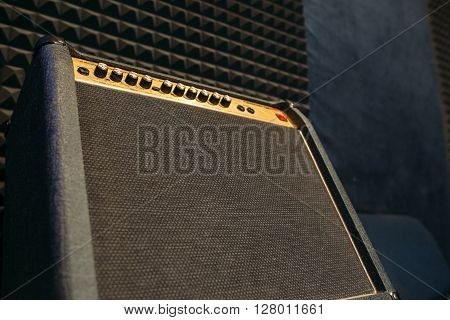 Electric guitar amplifier closep with free spce. Black professional guitar amplifier
** Note: Shallow depth of field