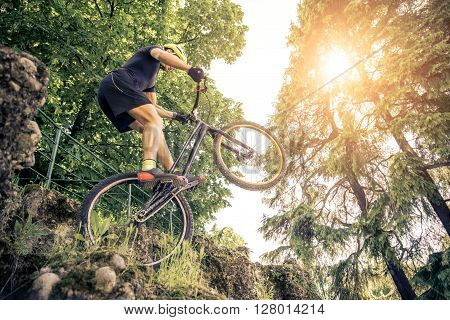 Man balancing on one wheel with his acrobatic bike