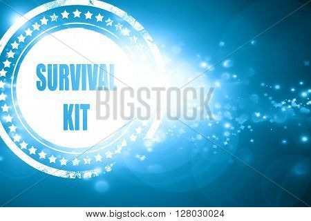 Blue stamp on a glittering background: Survival kit sign
