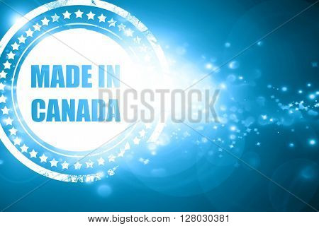 Blue stamp on a glittering background: Made in canada