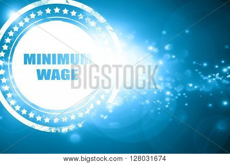 Blue stamp on a glittering background: minimum wage