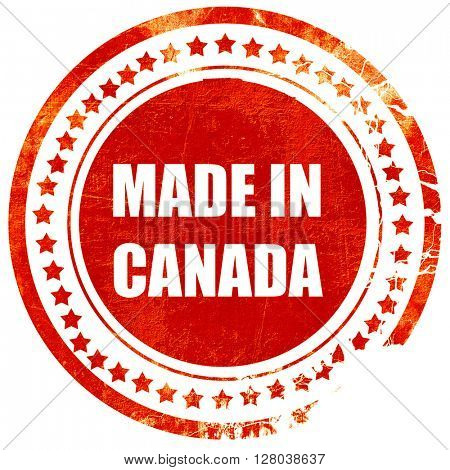 Made in canada, grunge red rubber stamp on a solid white backgro
