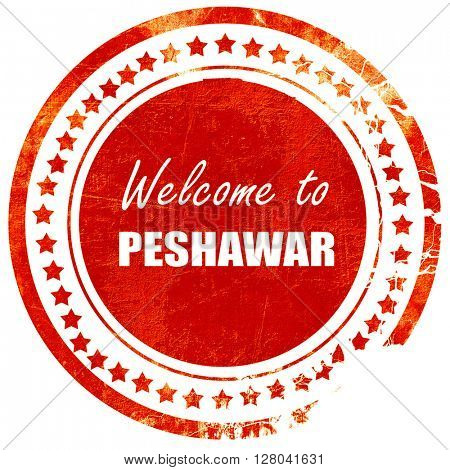 Welcome to peshawar, grunge red rubber stamp on a solid white ba