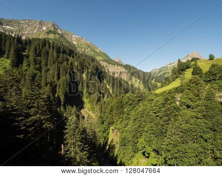 A view of Alpine mountains surrounding the village Schocken in Bregenzerwald region Vorarlberg Austria