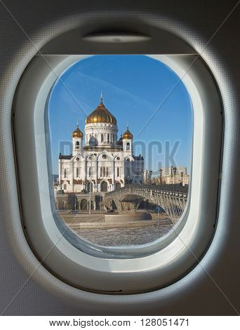 porthole and landmark Christ the Saviour Cathedral in Moscow against the backdrop of a frozen river