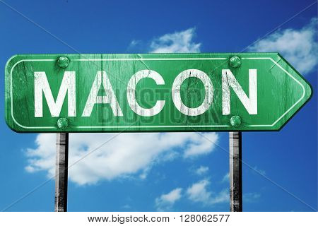macon road sign , worn and damaged look
