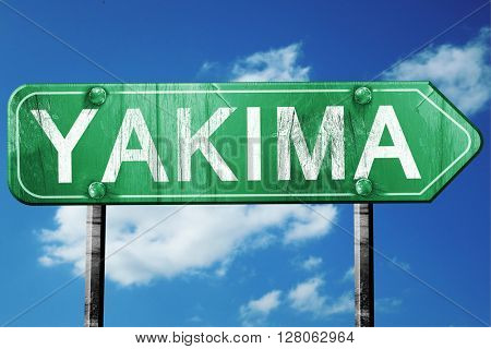 yakima road sign , worn and damaged look