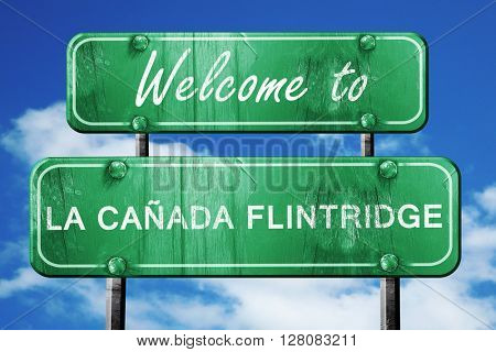 la canada flintridge vintage green road sign with blue sky backg