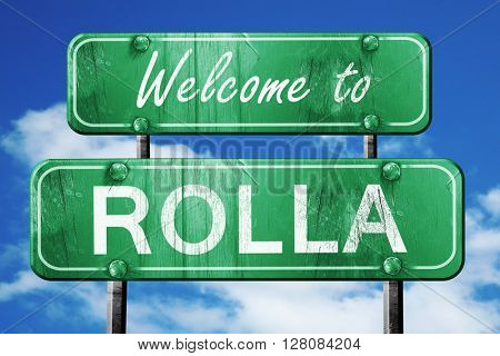 rolla vintage green road sign with blue sky background