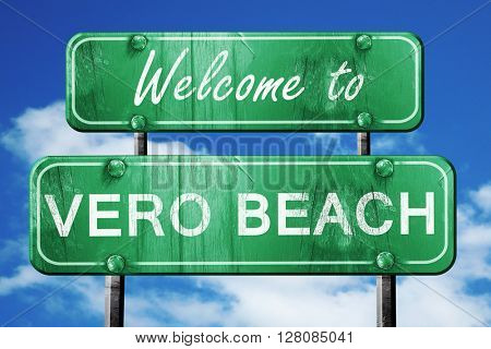 vero beach vintage green road sign with blue sky background