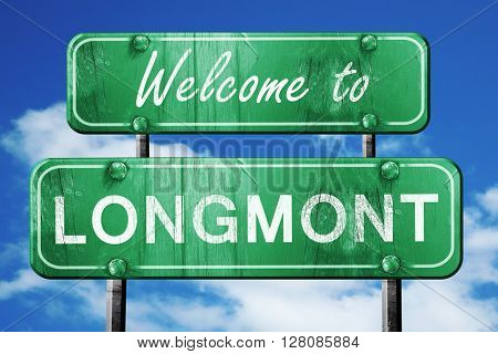 longmont vintage green road sign with blue sky background