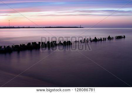The quiet sea and calm. A beautiful decline and a lighthouse in the background.