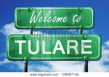 tulare vintage green road sign with blue sky background