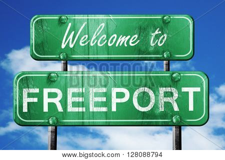 freeport vintage green road sign with blue sky background