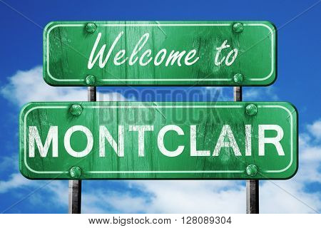montclair vintage green road sign with blue sky background