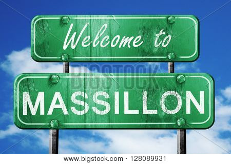massillon vintage green road sign with blue sky background