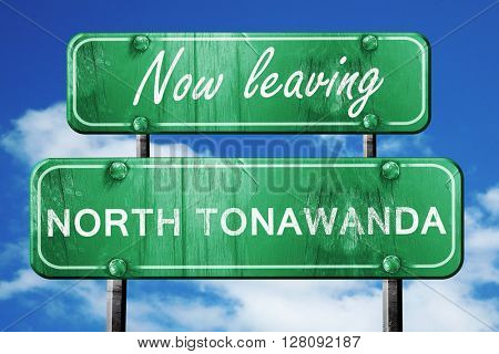 Leaving north tonawada, green vintage road sign with rough lette