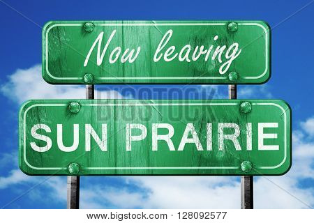 Leaving sun prairie, green vintage road sign with rough letterin