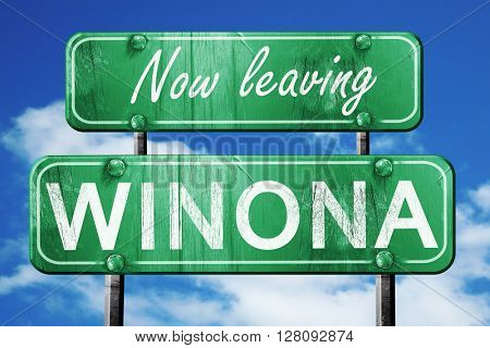 Leaving winona, green vintage road sign with rough lettering