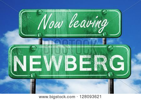 Leaving newberg, green vintage road sign with rough lettering