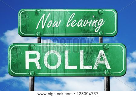Leaving rolla, green vintage road sign with rough lettering
