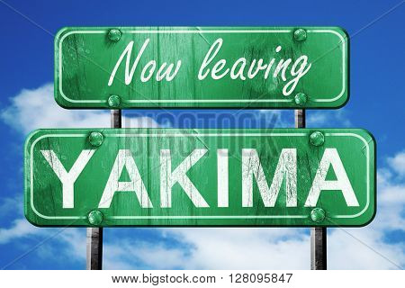 Leaving yakima, green vintage road sign with rough lettering